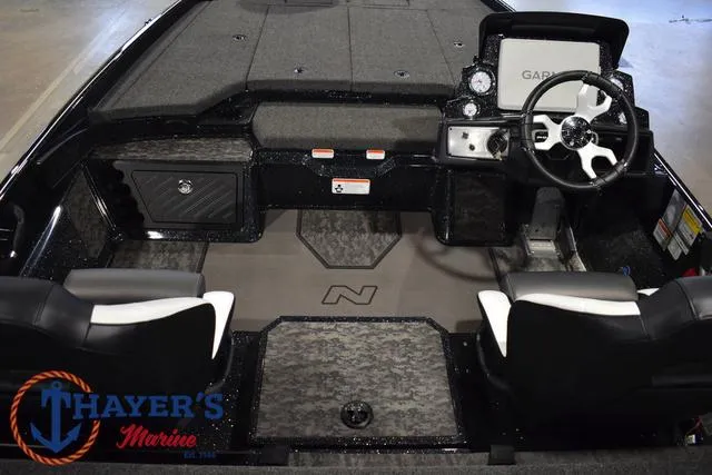 Slide: The Image of 2025 Nitro Z21 XL Pro boat interior with dual seats and Garmin dashboard. - 43