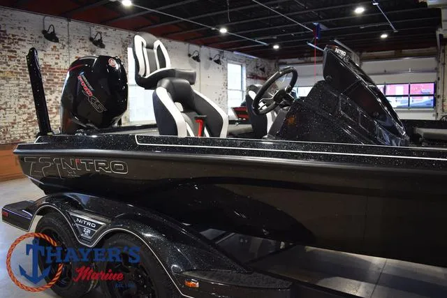 Slide: The Image of 2025 Nitro Z21 XL Pro boat in showroom, featuring sleek design and modern seating. - 46