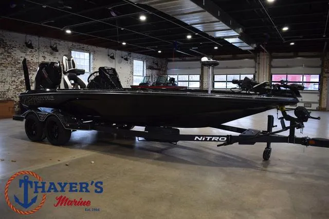 Slide: The Image of 2025 Nitro Z21 XL Pro boat on display at Thayer's Marine showroom. - 48