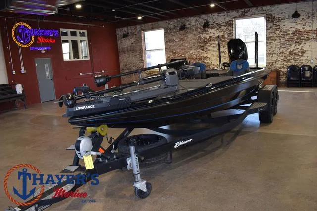 Slide: The Image of 2023 Blazer 625 Pro Elite boat displayed indoors at Thayer's Marine showroom. - 10