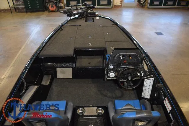 Slide: The Image of 2023 Blazer 625 Pro Elite boat interior with steering console and seating. - 15