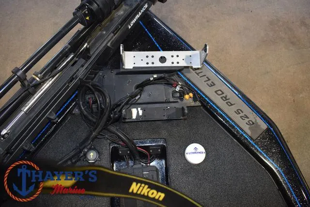 Slide: The Image of 2023 Blazer 625 Pro Elite boat interior with Lowrance equipment and Thayer's Marine branding. - 17