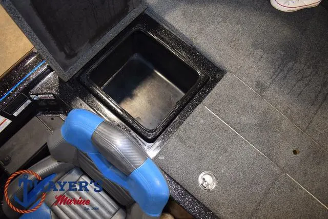 Slide: The Image of 2023 Blazer 625 Pro Elite boat interior with storage compartment and seating. - 22