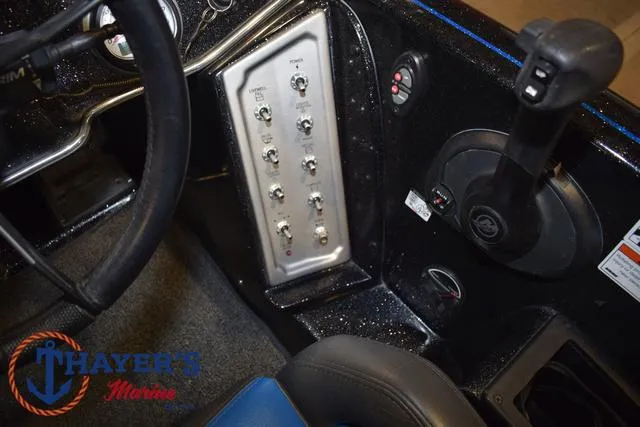 Slide: The Image of 2023 Blazer 625 Pro Elite boat dashboard with control panel and steering wheel. - 25