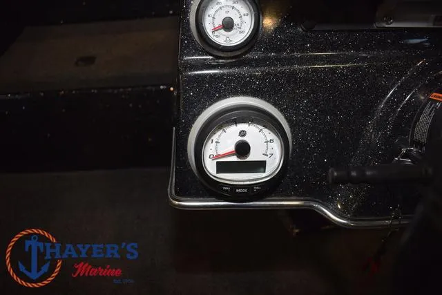 Slide: The Image of Dashboard of 2023 Blazer 625 Pro Elite boat with gauges, Thayer's Marine logo. - 26