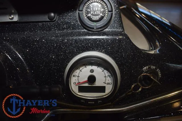 Slide: The Image of Dashboard of 2023 Blazer 625 Pro Elite boat with speedometer and lift plate gauge. - 27