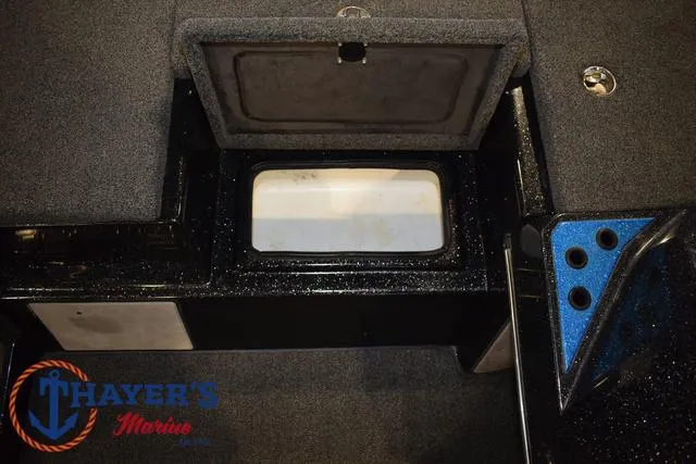 Slide: The Image of 2023 Blazer 625 Pro Elite boat storage compartment with Thayer's Marine logo. - 30