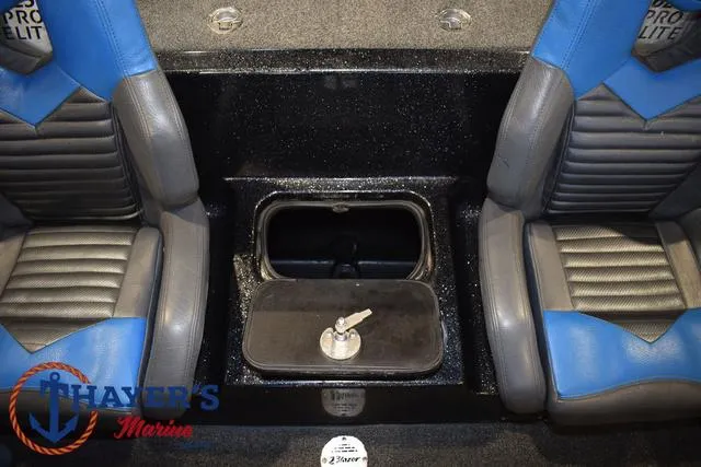 Slide: The Image of 2023 Blazer 625 Pro Elite boat interior with blue and gray seats, storage compartment. - 32