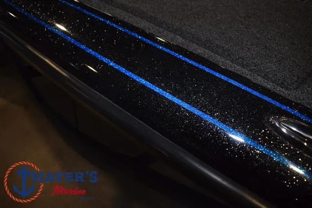 Slide: The Image of 2023 Blazer 625 Pro Elite boat with sparkling black and blue detailing. - 35
