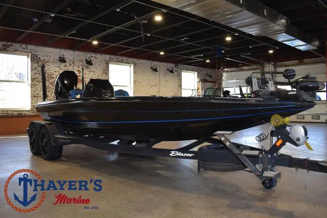 Slide: The Image of 2023 Blazer 625 Pro Elite boat displayed indoors at Thayer's Marine showroom. - 36