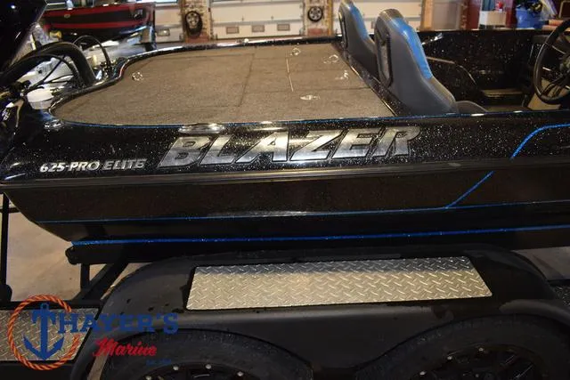 Slide: The Image of 2023 Blazer 625 Pro Elite boat on trailer at Thayer's Marine showroom. - 4