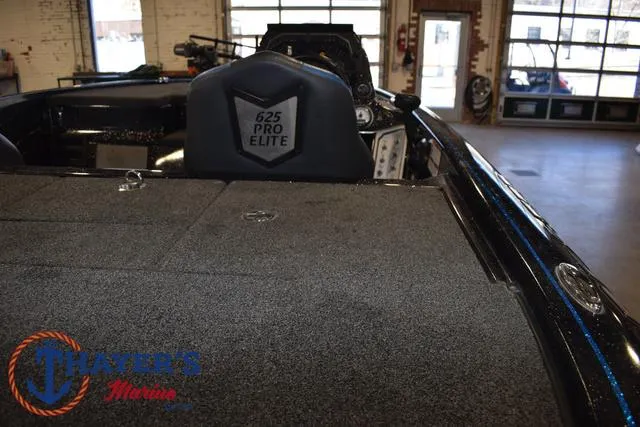 Slide: The Image of 2023 Blazer 625 Pro Elite boat interior in showroom, featuring Thayer's Marine logo. - 8