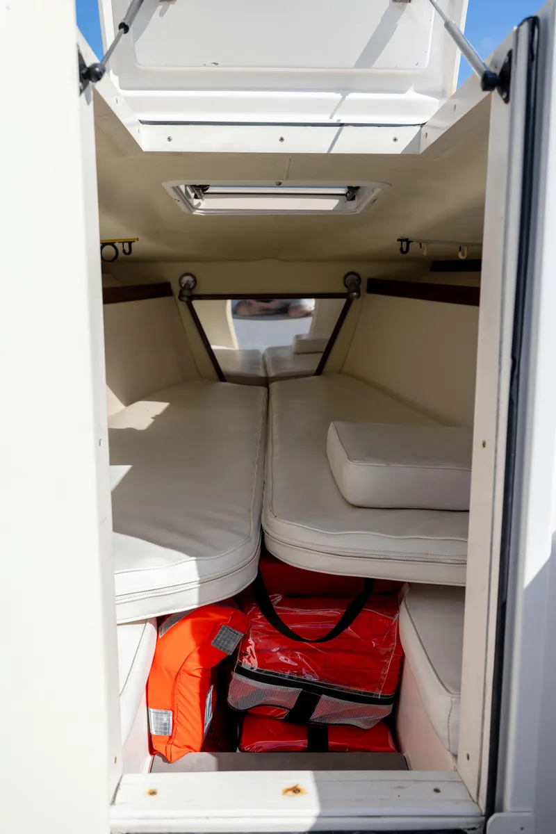 Slide: The Image of Interior cabin of 2005 Marlago 35 boat with cushions and life jackets. - 6