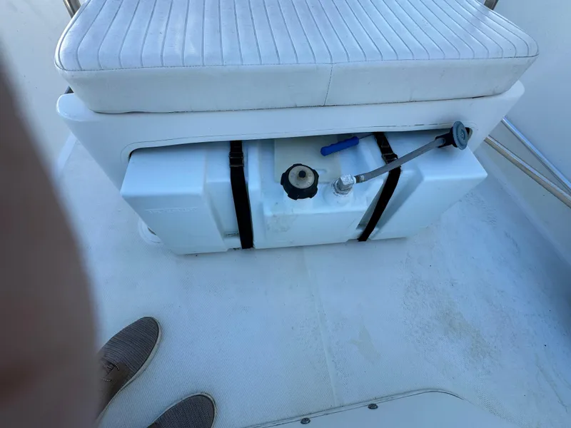 Slide: The Image of Boston Whaler 170 MONTUCK 2016 boat seat with storage compartment and fuel tank. - 16