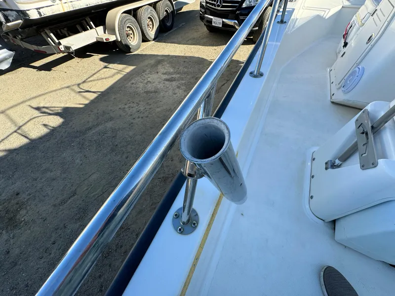 Slide: The Image of 2016 Boston Whaler 170 MONTUCK boat deck with rod holder and railing. - 18