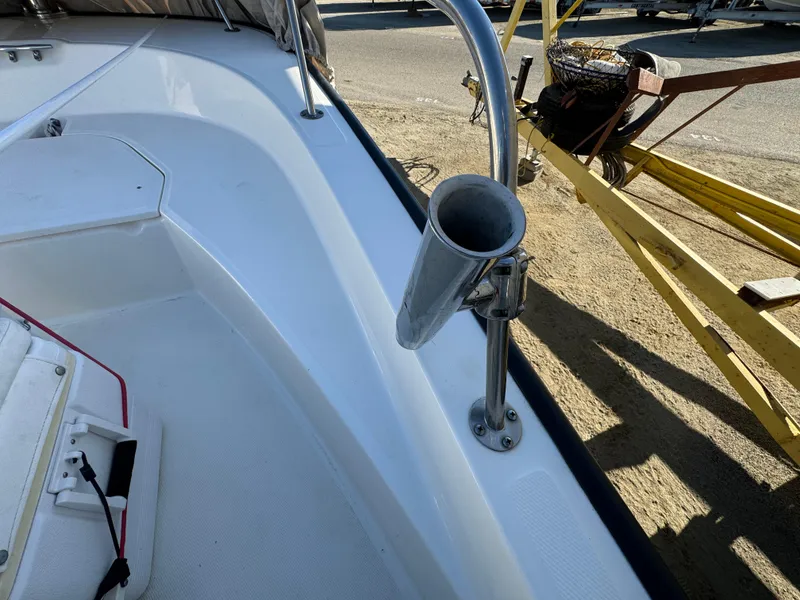 Slide: The Image of Boston Whaler 170 MONTUCK 2016 boat interior with rod holder and seating area. - 25