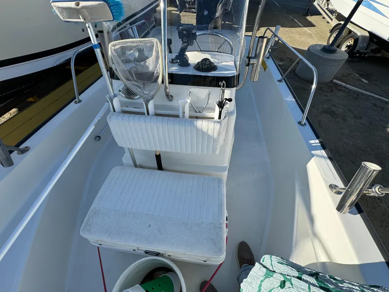 Slide: The Image of 2016 Boston Whaler 170 MONTUCK boat interior with seating and console. - 27