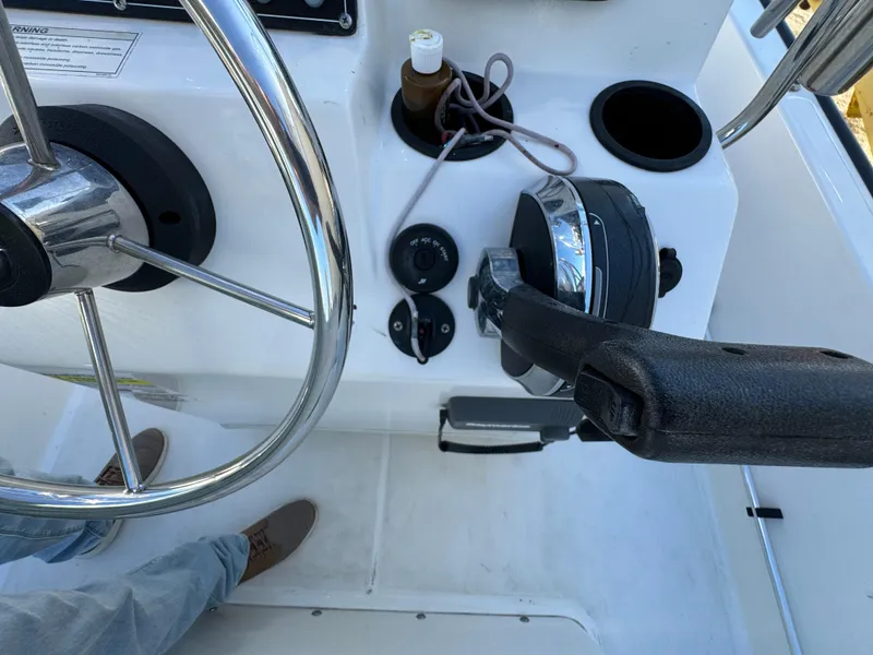 Slide: The Image of Steering console of 2016 Boston Whaler 170 MONTUCK boat with throttle and controls. - 36