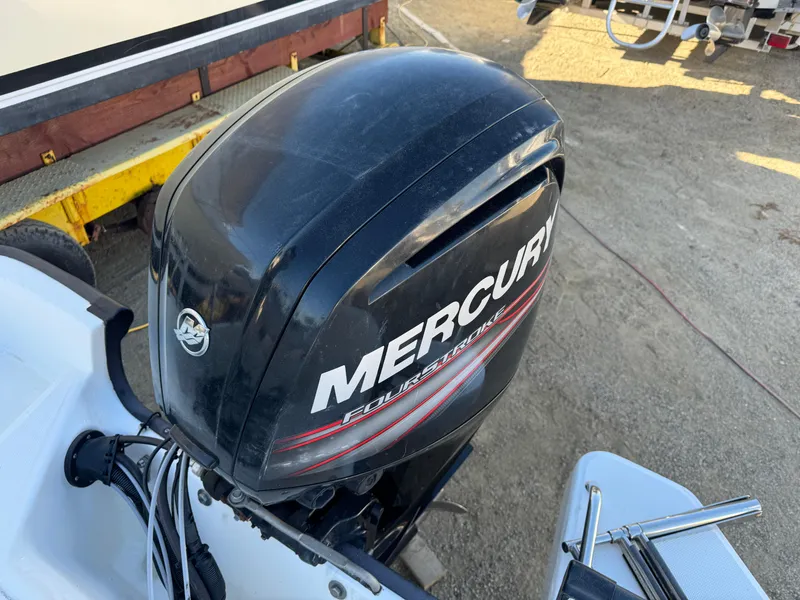 Slide: The Image of Boston Whaler 170 MONTUCK 2016 with Mercury outboard motor in a boatyard. - 40