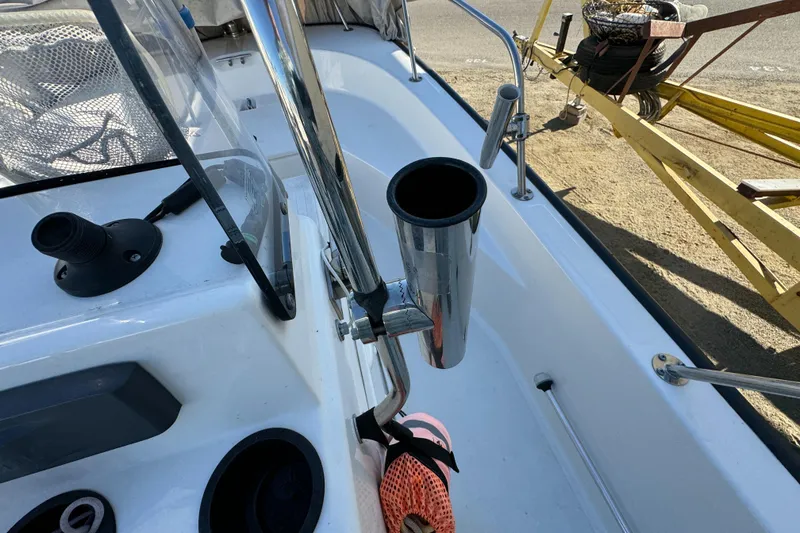 Slide: The Image of Boston Whaler 170 MONTUCK 2016 boat interior with rod holder and console details. - 43