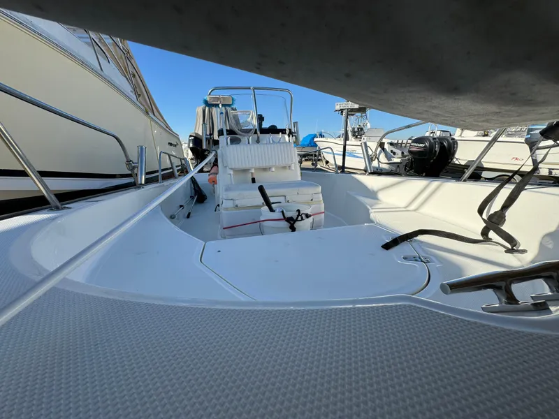 Slide: The Image of 2016 Boston Whaler 170 MONTUCK boat interior, featuring seating and steering console. - 6