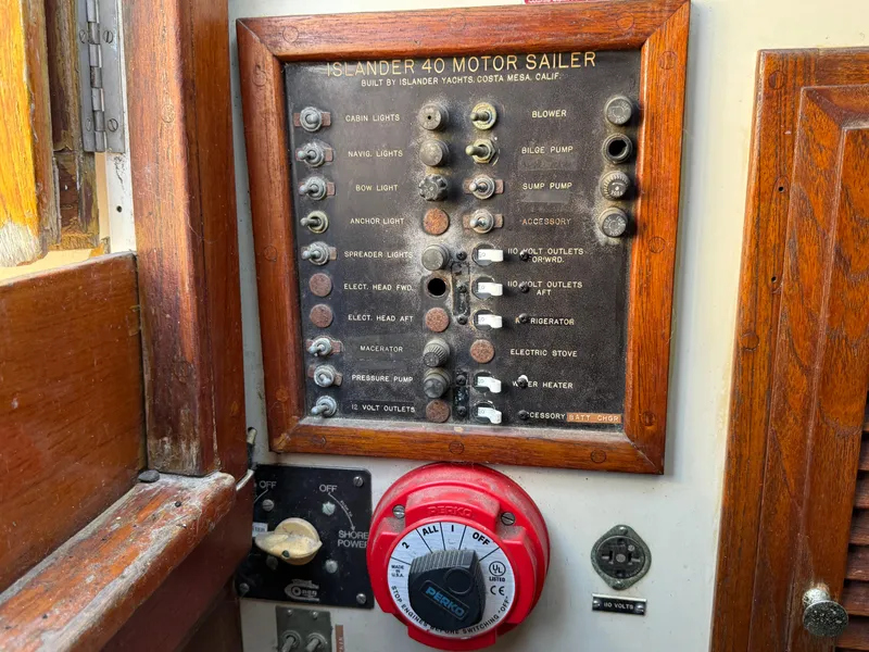 Slide: The Image of Control panel of a 1973 Islander 40 motor sailer with switches and dials. - 17