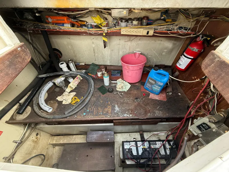 Slide: The Image of Workshop area on a 1973 Islander 40 sailboat with tools, fire extinguisher, and maintenance supplies. - 20