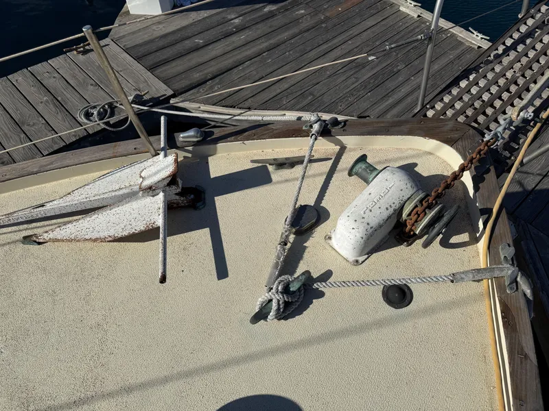 Slide: The Image of Deck of 1973 Islander 40 sailboat with anchor and winch. - 7