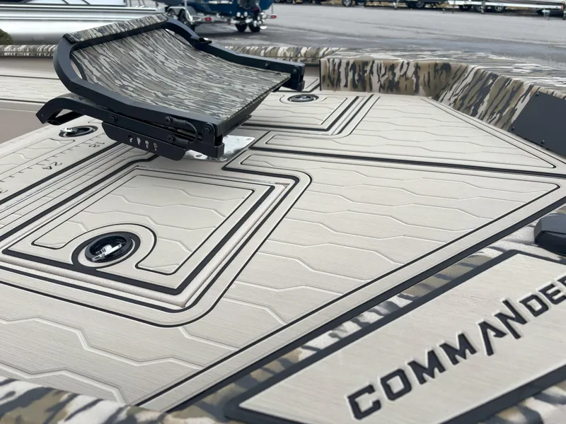 Slide: The Image of 2025 Avid 18 Commander boat deck with camouflage seat and textured surface. - 10