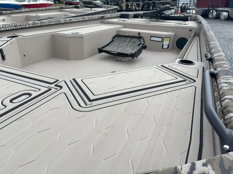 Slide: The Image of 2025 Avid 18 Commander boat deck with sleek design and storage compartments. - 6