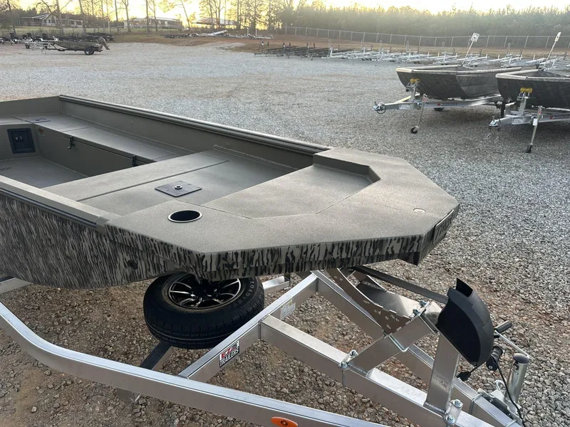 Slide: The Image of 2025 Thor Lake Hammer 1754 boat on trailer in gravel lot, side view. - 10