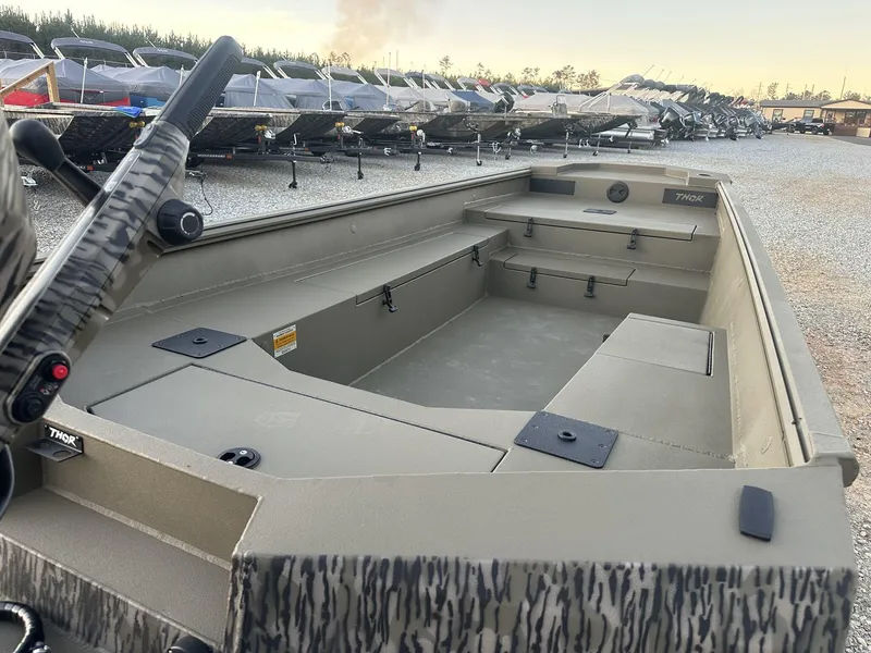 Slide: The Image of 2025 Thor Lake Hammer 1754 boat with Tohatsu 60 engine, parked outdoors. - 11