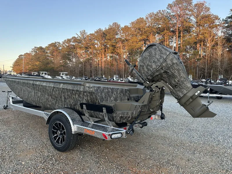 Slide: The Image of 2025 Thor Lake Hammer 1754 boat with Tohatsu 60 engine on trailer, camo design. - 3