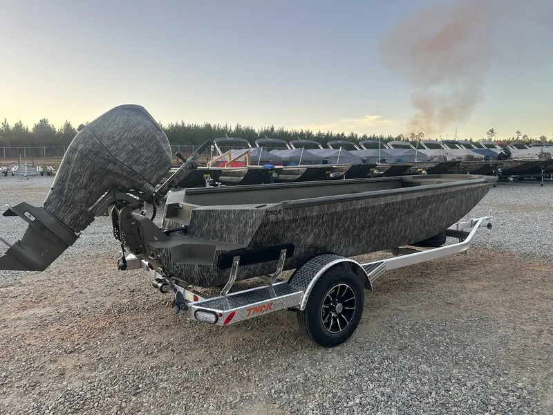 Slide: The Image of 2025 Thor Lake Hammer 1754 boat with Tohatsu 60 engine on a trailer. - 6