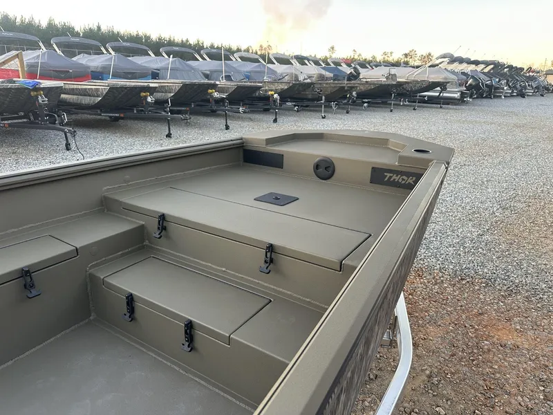 Slide: The Image of 2025 Thor Lake Hammer 1754 boat with Tohatsu 60, parked among other boats. - 9