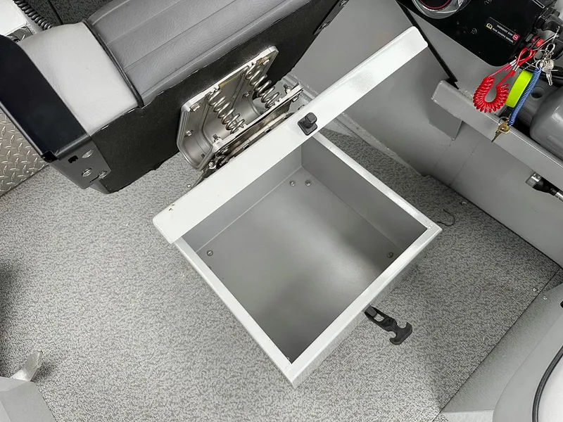 Slide: The Image of Open storage compartment in 2017 Hewescraft 160 Sportsman boat interior. - 13