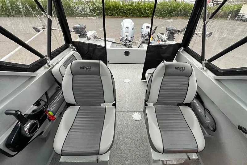 Slide: The Image of Interior of 2017 Hewescraft 160 Sportsman boat with two seats and control panel. - 15