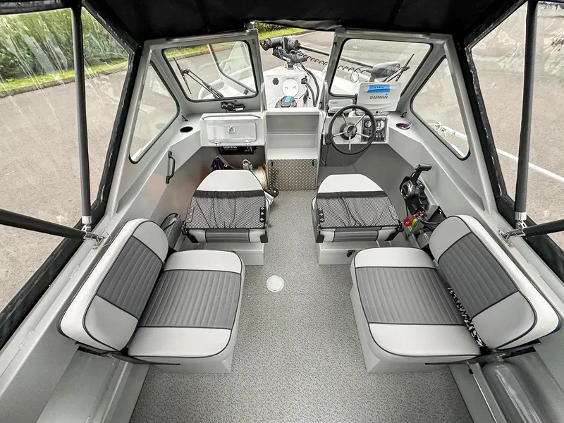 Slide: The Image of 2017 Hewescraft 160 Sportsman boat interior with seating and steering console. - 16