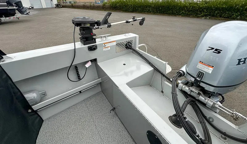 Slide: The Image of 2017 Hewescraft 160 Sportsman boat with Honda 75 outboard motor in parking lot. - 18