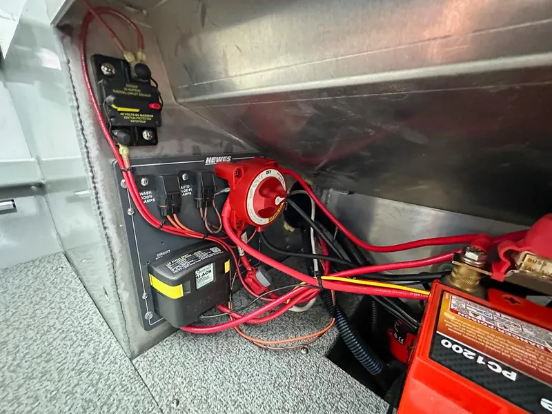 Slide: The Image of Electrical wiring and components inside a 2017 Hewescraft 160 Sportsman boat. - 20