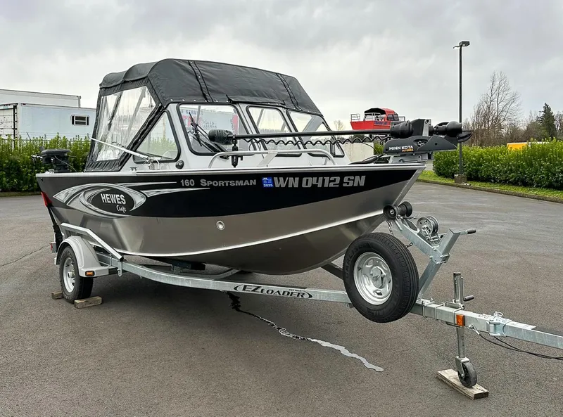 Slide: The Image of 2017 Hewescraft 160 Sportsman boat on trailer, parked outdoors. - 5