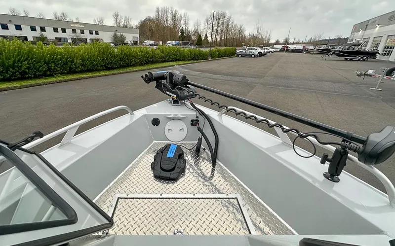 Slide: The Image of 2017 Hewescraft 160 Sportsman boat with trolling motor in parking lot. - 6
