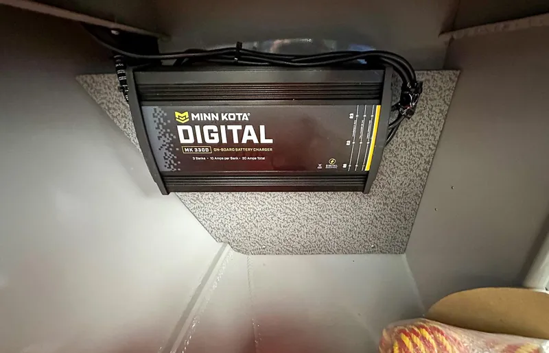 Slide: The Image of Minn Kota digital battery charger in 2017 Hewescraft 160 Sportsman boat. - 8