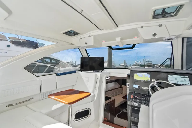 Slide: The Image of Interior of 2023 Pursuit OS 355 Offshore boat with modern navigation equipment. - 10
