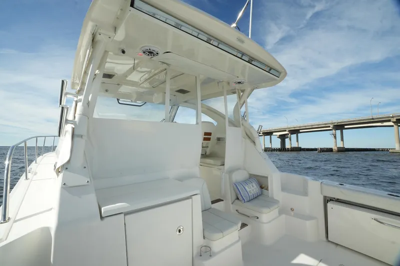 Slide: The Image of 2023 Pursuit OS 355 Offshore boat interior with bridge view. - 26