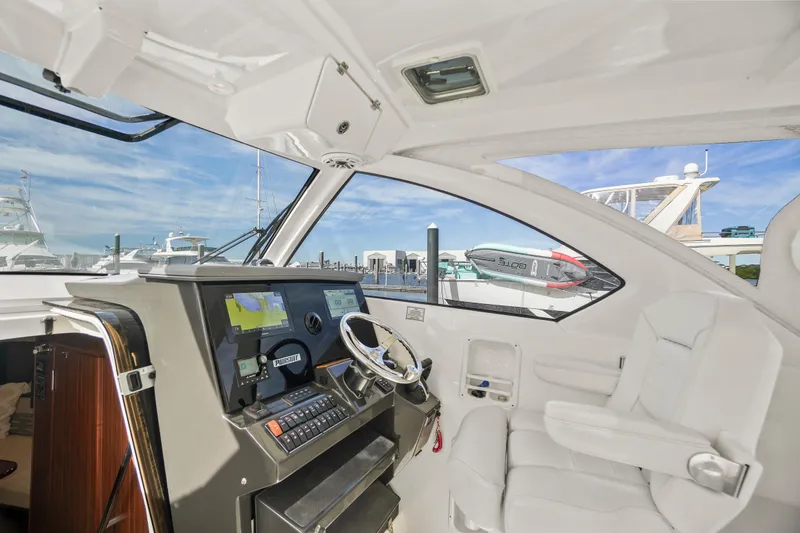 Slide: The Image of 2023 Pursuit OS 355 Offshore boat interior with modern helm and seating. - 35