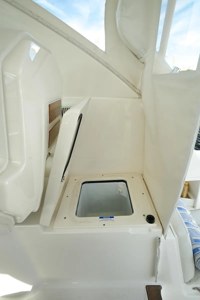 Slide: The Image of 2023 Pursuit OS 355 Offshore boat interior storage compartment. - 39