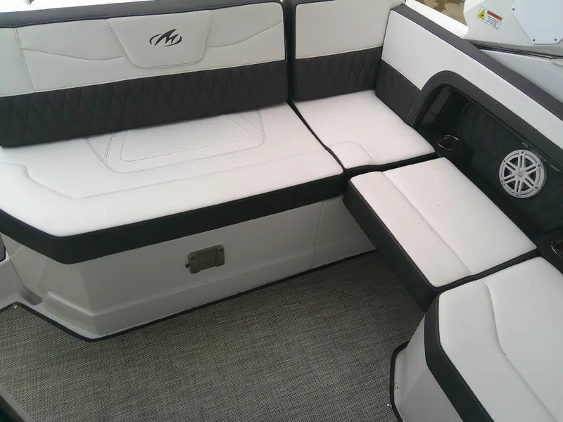Slide: The Image of 2020 Monterey 305 Super Sport boat interior with white and black seating. - 17