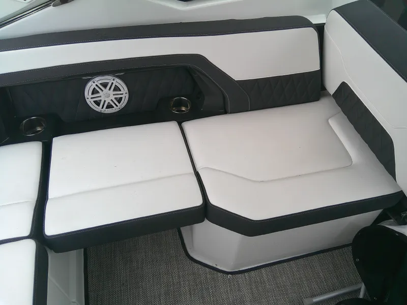 Slide: The Image of 2020 Monterey 305 Super Sport boat seating with stylish black and white upholstery. - 19