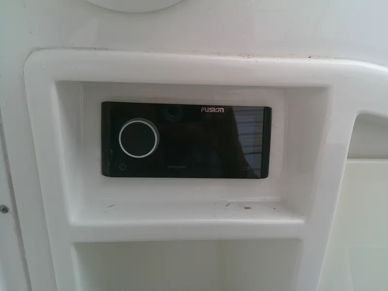 Slide: The Image of Fusion stereo system on 2020 Monterey 305 Super Sport boat dashboard. - 21